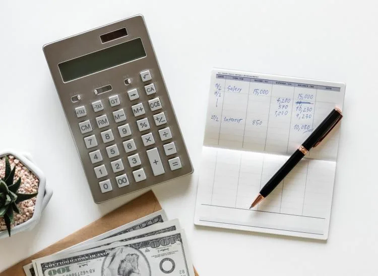 Savings account paperwork and calculator for how to calculate annual percentage yield